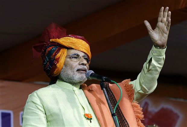 In this Tuesday, Dec. 4, 2012 photo, Gujarat Chief Minister Narendra Modi addresses an election campaign rally for upcoming Gujarat state assembly elections at Sanand, near Ahmadabad, India.