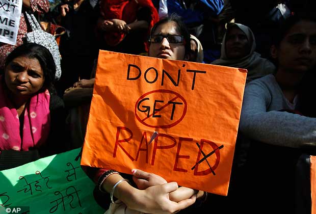 Indian women participate in a protest condemning the gang rape of a 23-year-old student on a city bus late Sunday in New Delhi, India, Tuesday, Dec. 18, 2012. The Indian parliament Tuesday witnessed outrage over the issue even as the victim is battling for her life at a city hospital. (AP Photo/Tsering Topgyal)