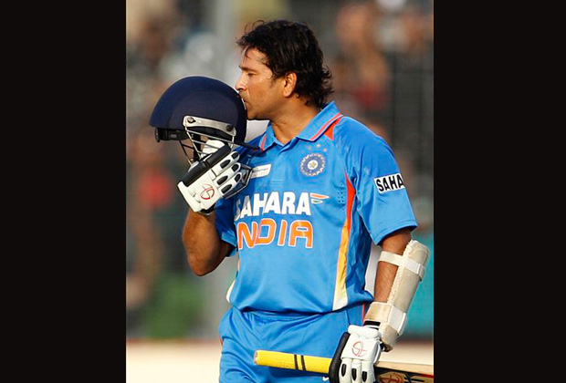 Indian cricketer Sachin Tendulkar kisses his helmet after scoring his 100th century during the Asia Cup cricket match against Bangladesh, in Dhaka, Bangladesh. India's batting great Tendulkar has announced Sunday, Dec. 23, 2012 his retirement from one-day cricket. (AP Photo)