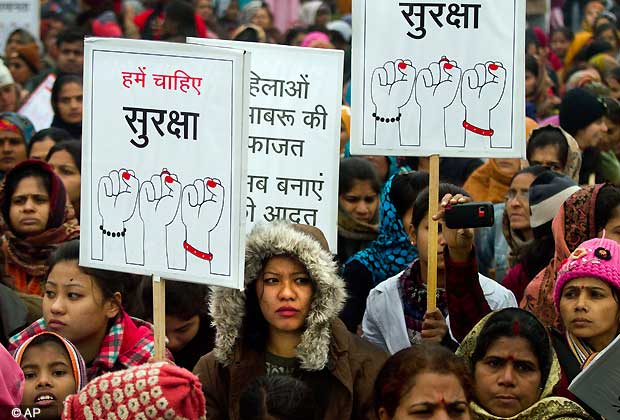 Indian women carry signs as they march to mourn the death of a gang rape victim in New Delhi, India, Wednesday, Jan. 2, 2013. The banners read 