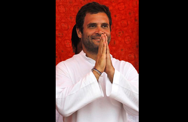 FILE – In this Saturday, July 9, 2011 file photo, Congress party leader Rahul Gandhi greets supporters during a gathering of farmers at the end of a four-day march he undertook in the farmlands of northern India at Aligarh. Gandhi, the scion of the Nehru-Gandhi dynasty, was on Saturday elevated to governing Congress party's No. 2 position as it prepares for parliamentary elections next year, a party spokesman said Saturday, Jan. 19, 2013. (AP Photo/Saurabh Das, File)