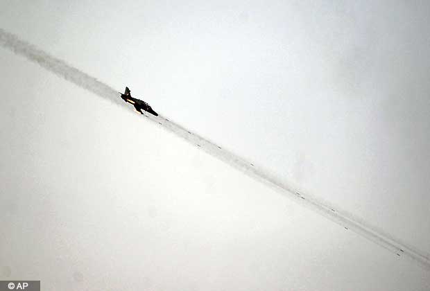 An Indian Air Force Jaguar aircraft fires rockets towards a target during the 