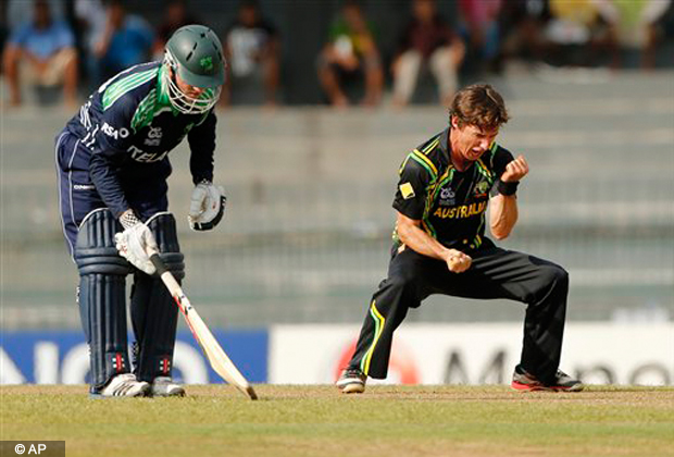 Australia's bowler Brad Hogg, right, celebrates after taking the wicket of Ireland's batsman Gary Wilson, unseen, as non striker Niall O'Brien watches during their ICC Twenty20 Cricket World Cup match in Colombo, Sri Lanka, Wednesday, Sept. 19, 2012. (AP Photo/Eranga Jayawardena)