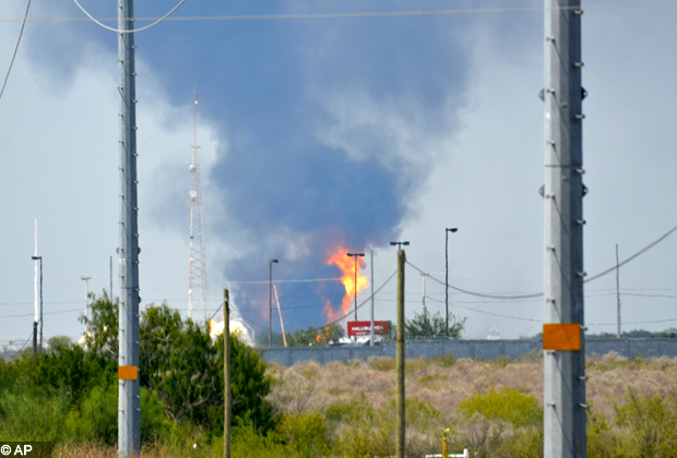 Fire and smoke rise from a gas pipeline distribution center in Reynosa, Mexico near Mexico's border with the United States, Tuesday Sept. 18, 2012. Mexico's state owned oil company, Petroleos Mexicanos, also known as Pemex said the fire had been extinguished and the pipeline had been shut off but ten people were killed during the incident. (AP Photo/El Manana de Reynosa)