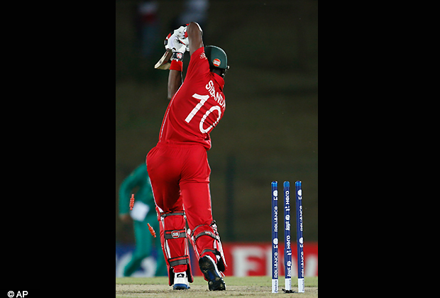 Zimbabwe's batsman Vusi Sibanda loses his wicket during the ICC Twenty20 Cricket World Cup match between South Africa and Zimbabwe in Hambantota, Sri Lanka, Thursday, Sept. 20, 2012. (AP Photo/Gemunu Amarasinghe)