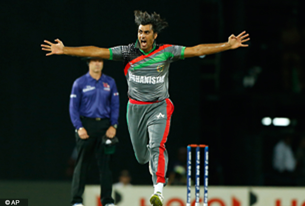 Afghanistan's bowler Shapoor Zadran, celebrates taking the wicket of England's batsman Craig Kieswetter, unseen, during their match in the ICC Twenty20 Cricket World Cup in Colombo, Sri Lanka, Friday, Sept. 21, 2012 . (AP Photo/Eranga Jayawardena)