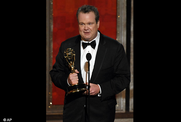 Eric Stonestreet accepts the award for outstanding supporting actor in a comedy series for Modern Family at the 64th Primetime Emmy Awards at the Nokia Theatre on Sunday, Sept. 23, 2012, in Los Angeles. (AP Photo)
