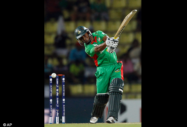 The bat swings and the ball is about to hit stumps to dismiss Bangladesh batsman Mohammad Ashraful during the ICC Twenty20 Cricket World Cup match against Pakistan in Pallekele, Sri Lanka, Tuesday, Sept. 25, 2012. (AP Photo/Aijaz Rahi)