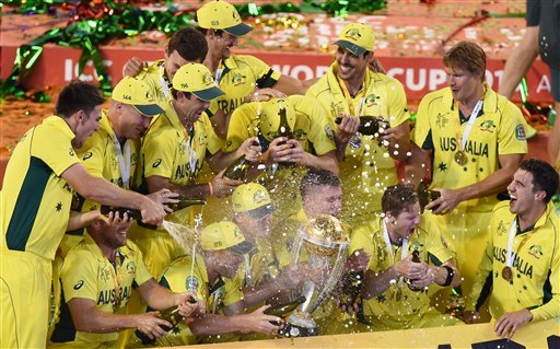 The Australian team spray champagne as they celebrate their seven wicket win over New Zealand in the ICC Cricket World Cup final in Melbourne, Australia, Sunday, March 29, 2015. (AP Photo)