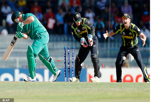 South Africa's batsman Richard Levi, left, is bowled out by Australia's bowler Xavier Doherty, unseen, as wicketkeeper, Matthew Wade, center, and fielder Cameron White watch during the ICC Twenty20 Cricket World Cup Super Eight match between Australia and South Africa in Colombo, Sri Lanka, Sunday, Sept. 30, 2012 . (AP Photo/Eranga Jayawardena)