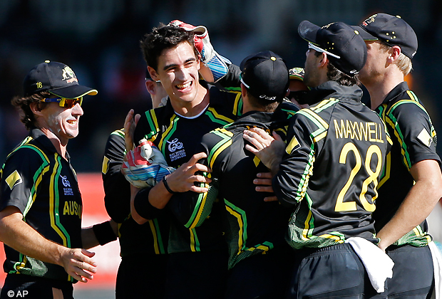 Members of the Australia's team congratulate their bowler Mitchell Starc, second left, for the wicket of Pakistan's captain Mohammad Hafeez, unseen, during their ICC Twenty20 Cricket World Cup Super Eight match in Colombo, Sri Lanka, Tuesday, Oct. 2, 2012 . (AP Photo/Eranga Jayawardena)