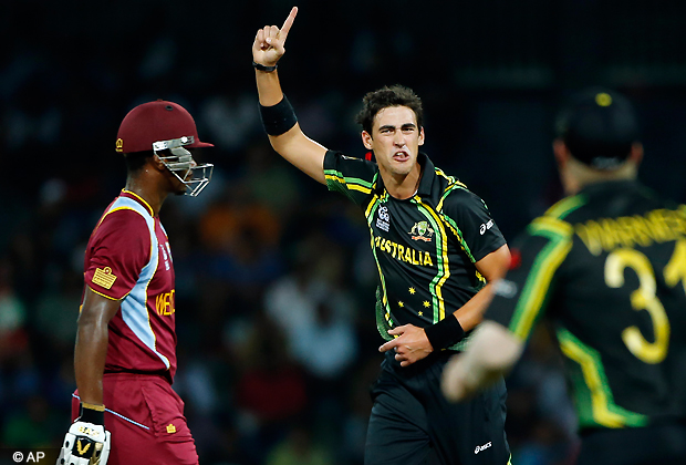 Australia's bowler Mitchell Starc, right, celebrates taking the wicket of West Indies' batsman Johnson Charles, left, during the ICC Twenty20 Cricket World Cup semi final match between Australia and West Indies' in Colombo, Sri Lanka, Friday, Oct. 5, 2012 . (AP Photo)