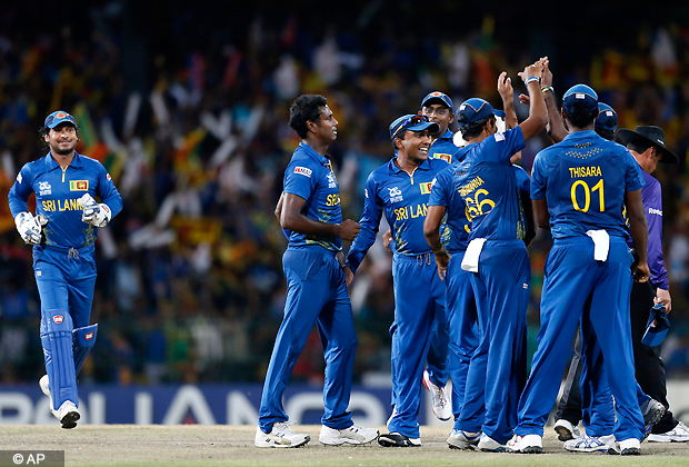 Sri Lanka's bowler Angelo Mathews, second left, celebrates the dismissal of West Indies' batsman Johnson Charles, unseen, with teammates during their ICC Twenty20 Cricket World Cup final match between in Colombo, Sri Lanka, Sunday, Oct. 7, 2012. (AP Photo)