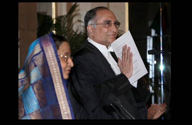 Indian President Pratibha Patil, left, looks on after swearing in Justice Sarosh Homi Kapadia, right, as the Chief Justice of India at the presidential palace in New Delhi, India, Wednesday, May 12, 2010. (AP Photo