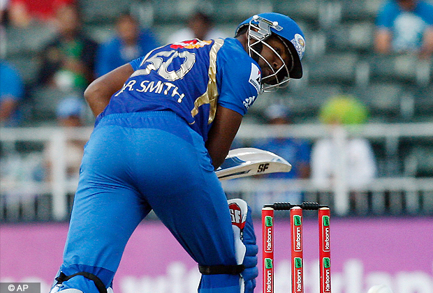 Mumbai Indians batsman Dwayne Smith watches his shot off Highveld Lions Sohail Tanveer, unseen, bowling during the Champions League Twenty20 cricket match at the Wanderers Stadium, Johannesburg, South Africa, Sunday, Oct. 14, 2012. (AP Photo)