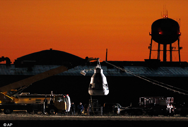 As the sun rises, workers prepare at the launch site, ahead of an attempt by Felix Baumgartner to break the speed of sound with his own body by jumping from a space capsule lifted by a helium balloon, Sunday, Oct. 14, 2012, in Roswell. (AP Photo)