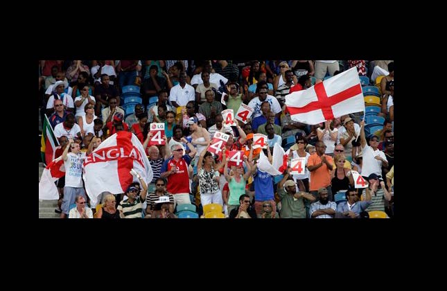 England's cricket fans celebrate after opening batsman Craig Kieswetter shot a four at the Twenty20 Cricket World Cup final match with Australia in Bridgetown, Barbados, Sunday, May 16, 2010. (AP Photo/Andres Leighton)