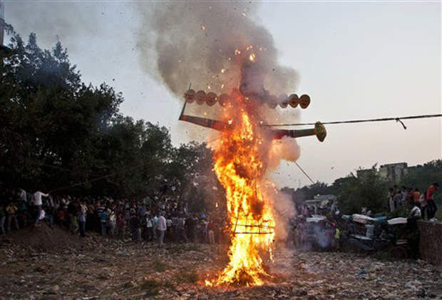 An effigy of demon king Ravana goes up in flames during Dussehra celebrations in New Delhi, India, Wednesday, Oct. 24, 2012. Dussehra commemorates the triumph of Lord Rama over the demon king Ravana, marking the victory of good over evil. (AP Photo)