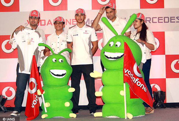 Vodafone McLaren Mercedes racing star Lewis Hamilton and Vodafone Business Services Director Naveen Chopra at a press conference in New Delhi (Photo IANS)