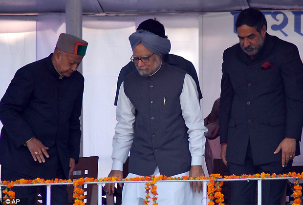 Indian Prime Minister Manmohan Singh, center, prepares to sit at an election rally in Una, Himachal Pradesh, India, Sunday, Oct. 28, 2012. (AP Photo)