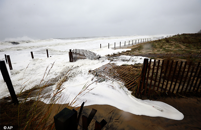 Sea foam washes over the beach as Hurricane Sandy bears down on the East Coast, Monday, Oct. 29, 2012, in Ocean City, Md. (AP Photo)