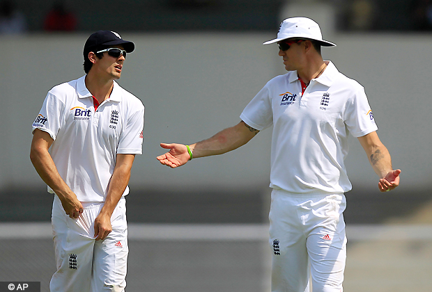 England's cricketer Kevin Pietersen, right, speaks with captain Alastair Cook during a warm up match against India A in Mumbai, India, Oct. 30, 2012. (AP Photo)