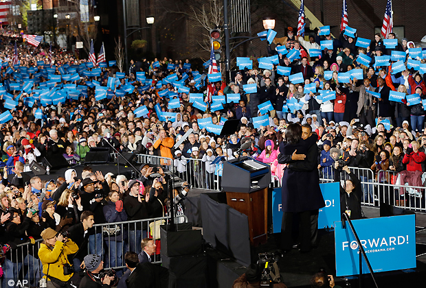 President Barack Obama, first lady Michelle Obama embrace on stage during his final 2012 campaign event in downtown Des Moines, Iowa, Nov. 5, 2012. (AP Photo)