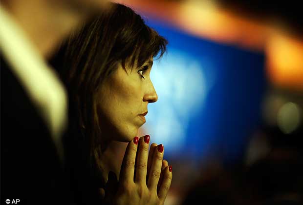 Nancy French, from Columbia, Tenn., watches vote results displayed on a television during Republican presidential candidate and former Massachusetts Gov. Mitt Romney's election night rally, Tuesday, Nov. 6, 2012, in Boston. (AP Photo)