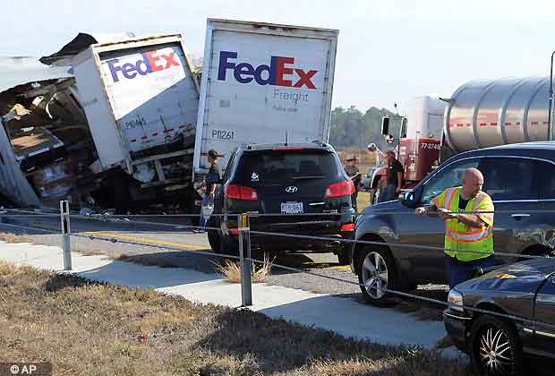 Cars and Trucks are piled on Interstate 10 in Southeast Texas Thursday Nov. 22, 2012. The Texas Department of Public Safety says at least 35 people have been injured in a more than 50 vehicle pileup. (AP Photo/The Beaumont Enterprise, Guiseppe Barranco)