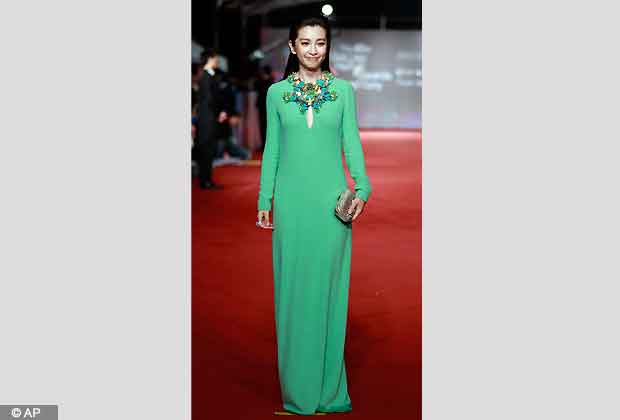 Chinese actress Li Bingbing smiles as she arrives at the 49th Golden Horse Awards at the Luodong Cultural Working House in Yilan County, Taiwan, Saturday, Nov. 24, 2012. Li is a guest at this year's Golden Horse Awards one of the Chinese language film industry's biggest annual events. (AP Photo/Wally Santana)