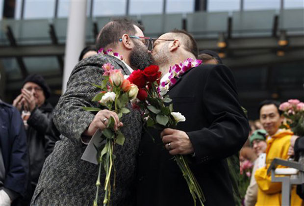 Liam, right, and Richard Sauer Wooden kiss on the steps of Seattle City Hall after getting married, Sunday, Dec. 9, 2012, in Seattle.(AP Photo)