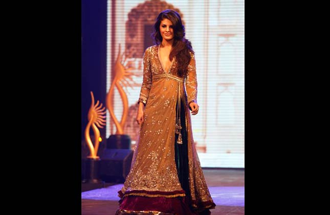 Sri Lankan born Bollywood actress Jacqueline Fernandez showcases a design from Indian designer Manish Malhothra, unseen, during a fashion show as part of the three day long International Indian Film Academy (IIFA) awards in Colombo, Sri Lanka, Thursday, June 3, 2010. Some of India's top movie stars converged in Sri Lanka on Thursday for Bollywood's annual roadshow despite calls to boycott the event because of the alleged killing of Tamil civilians during the final stages of the country's decades long civil war. (AP Photo/Eranga Jayawardena)