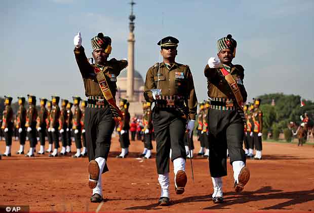 Indian infantry soldiers and the President's Body Guards in ceremonial attire take part in the Change of guard ceremony in front of the main entrance of the Rashtrapati Bhavan or the Presidential Palace, in New Delhi, India, Saturday, Dec. 8, 2012. (AP Photo/Altaf Qadri)