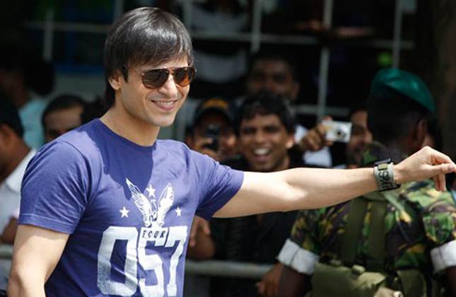 Bollywood actor Vivek Oberoi gestures as he arrives for a charity cricket match between IFFA XI and Sangakkara's XI as part of the three day long International Indian Film Academy (IIFA) awards in Colombo, Sri Lanka, Friday, June 4, 2010. Some of India's top movie stars converged in Sri Lanka on Thursday for Bollywood's annual roadshow despite calls to boycott the event because of the alleged killing of Tamil civilians during the final stages of the country's decades long civil war. (AP Photo/Eranga Jayawardena)