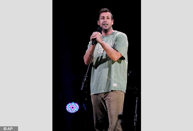 This image released by Starpix shows Adam Sandler performing at the 12 12 12 The Concert for Sandy Relief at Madison Square Garden in New York on Wednesday, Dec. 12, 2012. Proceeds from the show will be distributed through the Robin Hood Foundation. (AP Photo/Starpix, Dave Allocca)