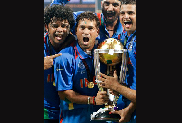 India's Sachin Tendulkar, second from left, poses with the trophy with teammates, from left, Shantakumaran Sreesanth, Harbhajan Singh and Suresh Raina after winning in the Cricket World Cup final match against Sri Lanka, in Mumbai, India. India's batting great Tendulkar announced his retirement from one day cricket on Sunday, Dec. 23, 2012 amid speculation he was contemplating retirement from all forms of international cricket. (AP Photo)