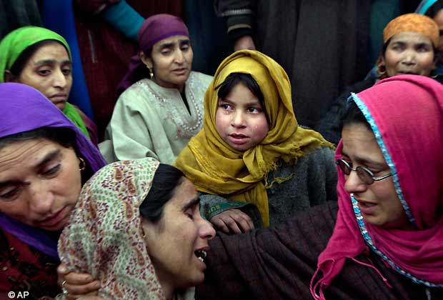 Tears roll down the cheeks of a young Kashmiri girl as she grieves during the funeral procession of Imtiyaz Ahmed, a suspected militant of Lashkar e Taiba, in Petipora, a village 55 kilometers (34 miles) south of Srinagar, India, Friday, Dec. 28, 2012. Indian forces on Friday killed two suspected rebels in a gunbattle and wounded seven civilians later during anti India protests in southern Kashmir, police said. (AP Photo/Dar Yasin)