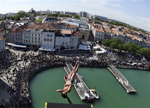 This photo provided by DPPI agency Saturday, May 15, 2010 shows competitor Hassan Mouti of France diving from the 27 metre high platform, during the first round of the 2010 Red Bull Cliff Diving world series in La Rochelle, western France, Friday, May 14, 2010.(AP Photo/Vincent Curutchet) NO SALES EDITORIAL USE ONLY PHOTO