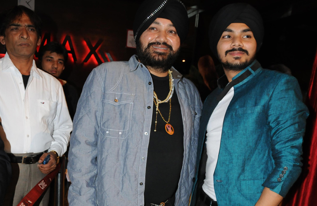 Upcoming actor Gurdeep Singh Mehndi with father singer Daler Mehndi at the premiere of his debut film Meri Shadi Karao in Cinemax, Mumbai. (Photo IANS)