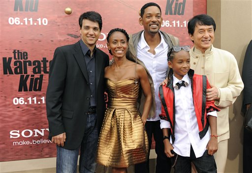 Ralph Macchio, left, star of the original The Karate Kid, poses with, from left, Jada Pinkett Smith and Will Smith, producers of a re make of the film, and the Smiths' son Jaden and Jackie Chan, co stars of the new film, at the premiere in Los Angeles, Monday, June 7, 2010. (AP Photo/Chris Pizzello)
