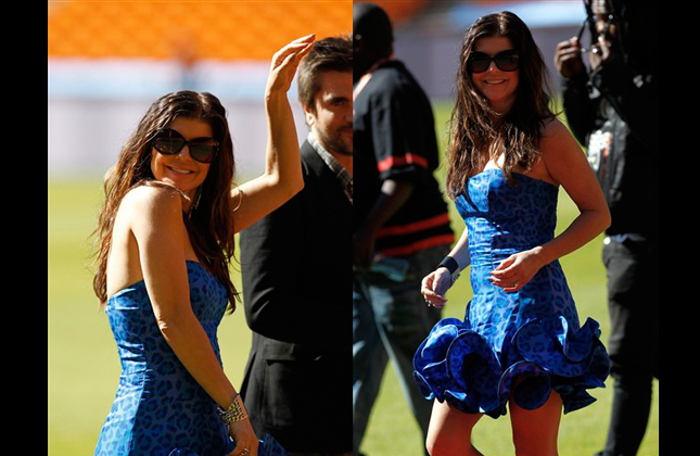 Black Eyed Pea's singer Fergie smiles during a photo opportunity at the Soccer City stadium in Johannesburg, South Africa, Wednesday, June 9, 2010. The Black Eyed Peas are going to perform at the opening concert for the soccer World Cup on June 10. (AP Photo/Hassan Ammar)