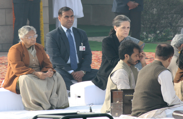 UPA Chairperson Sonia Gandhi and Delhi Chief Minister Sheila Dikshit paying tributes at the Samadhi of Mahatma Gandhi on the occasion of Martyr s Day in Rajghat, New Delhi. (Photo Amlan Paliwal/IANS)