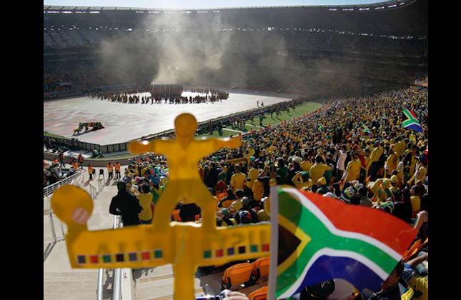 Spectators watch dancers perform during the opening ceremony before the World Cup group A soccer match between South Africa and Mexico at Soccer City in Johannesburg, South Africa, on Friday, June 11, 2010. (AP Photo/Ivan Sekretarev)