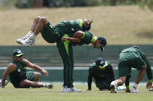 Pakistan cricket team members warm up during a practice session ahead of the Asia Cup match against Sri Lanka in Dambulla, Sri Lanka, Monday, June 14, 2010. The four nation cricket event in which India and Bangladesh also play kicks off Tuesday. (AP Photo/Eranga Jayawardena)