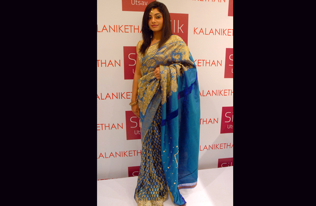 Kannada Actress Bhavana Rao posing with silk saris during the SILK UTSAV of Kanjivaram Saris organized by Kalanikethan, in Bangalore on Friday 15th of Feb 2013. (Photo IANS)