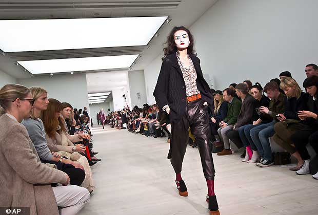 A model wears a design created by Vivienne Westwood during London Fashion Week, at the Saatchi Gallery in West London, Sunday, Feb. 17, 2013.