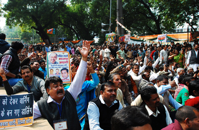 BJP President Rajnath Singh with party s Delhi State unit President Vijay Goel at a rally in protest against Union Home Minister Sushil Kumar Shinde for his statement on BJP and RSS, at Jantar Mantar in New Delhi on Feb. 20, 213. (Photo IANS)