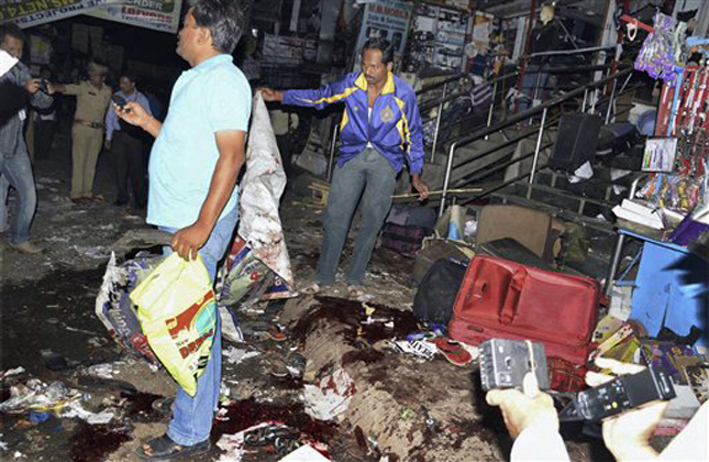 The scene of a blast at Dilsukhnagar in Hyderabad, India, Thursday, Feb.21, 2013. At least five people were killed Thursday in a pair of explosions in crowded areas of the southern Indian city of Hyderabad, police said. More were feared dead and injured. (AP Photo) INDIA OUT