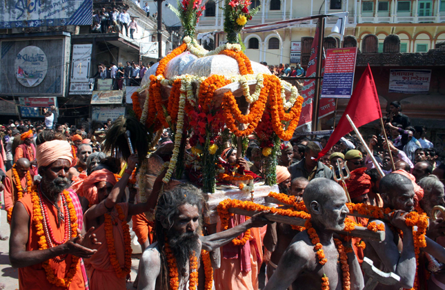 Naga sadhus with the shahi palki during a procession for upcoming Maha Shivratri festival in Varanasi on March 2, 2013. (Photo IANS)