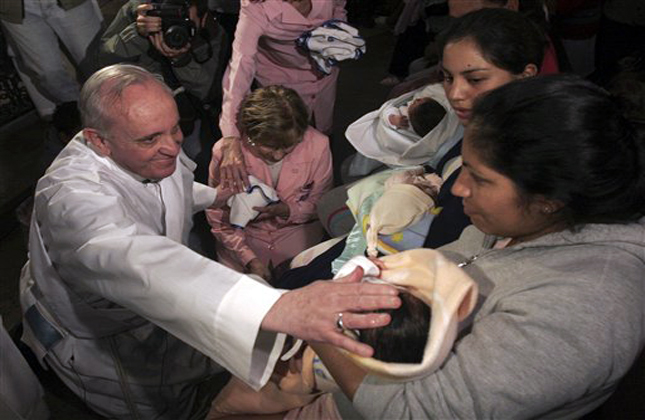 In this March 21 2011 photo, Argentina's Cardinal Jorge Mario Bergoglio touches a baby after a Mass in Buenos Aires, Argentina. Latin Americans reacted with joy on Wednesday at news that Bergoglio has become the first pope ever from the Americas and the first from outside Europe in more than a millennium. (AP Photo/DyN)